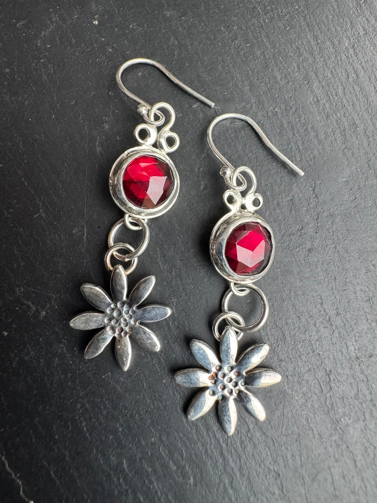 Garnet and Daisy silver dangly earrings.