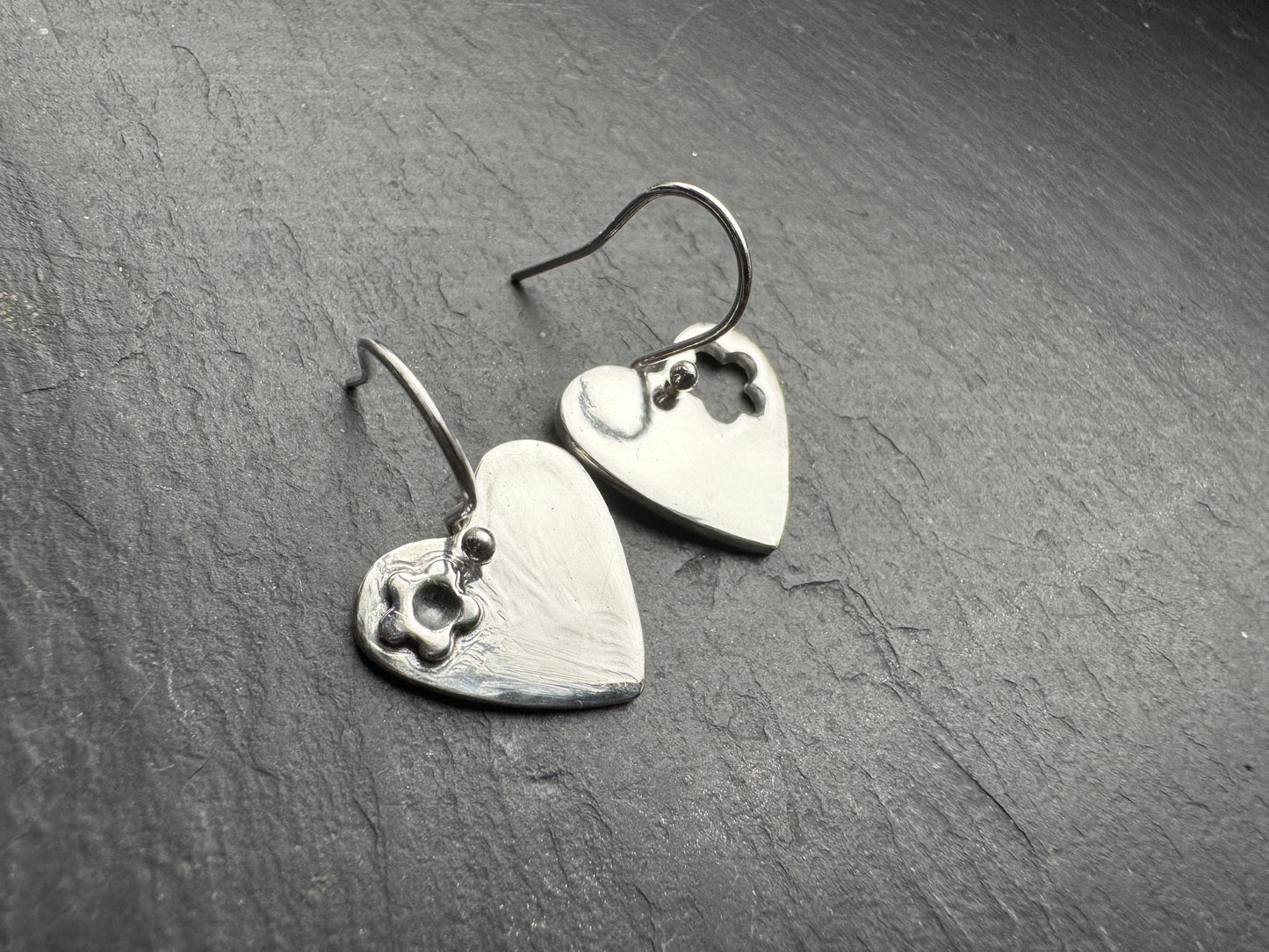 Handmade silver forget-me-not dangly heart earrings