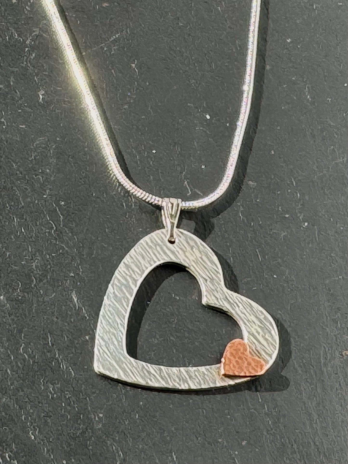 Handmade heart on heart silver and copper necklace