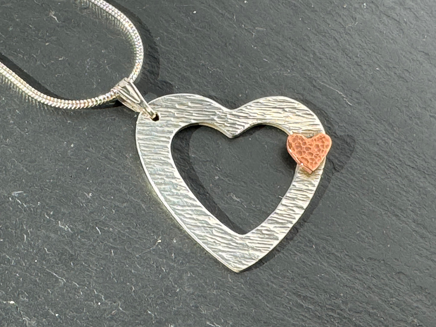 Handmade heart on heart silver and copper necklace