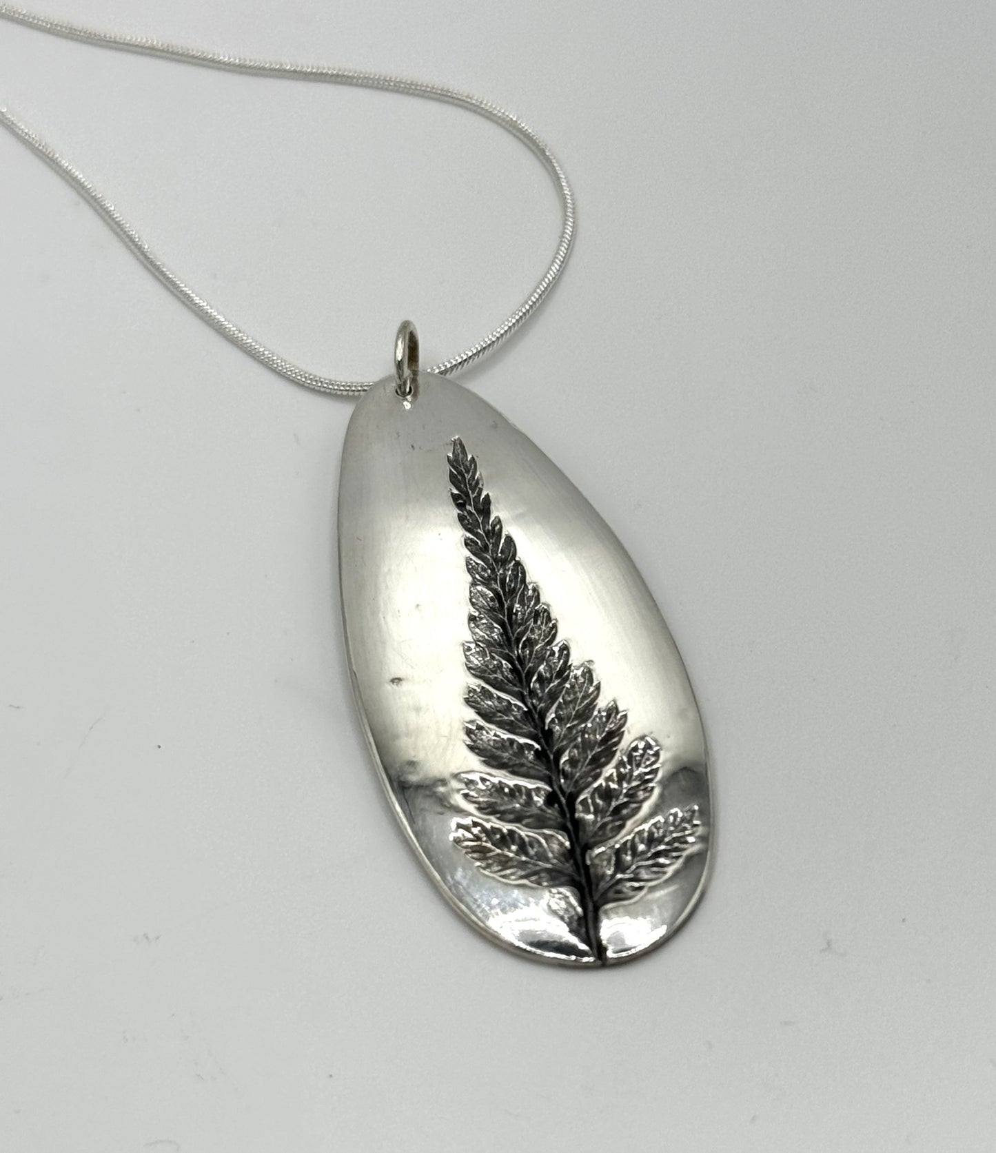 Fern imprint fine silver pendant