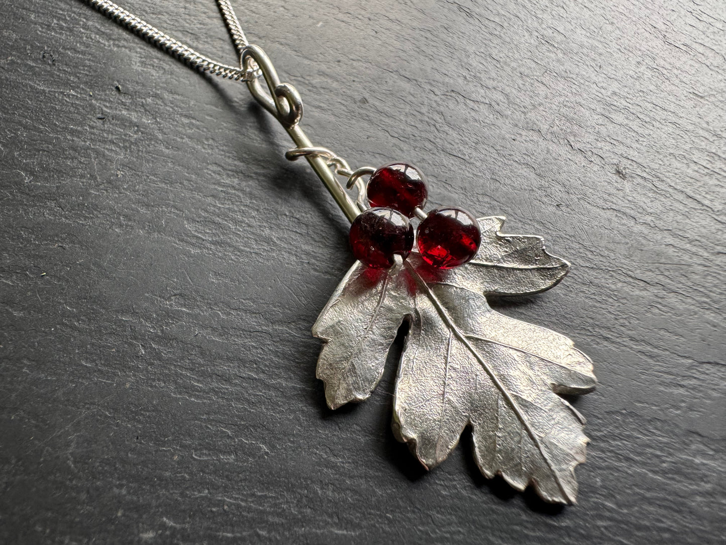 Hawthorn leaf silver pendant with red garnet stone berries 