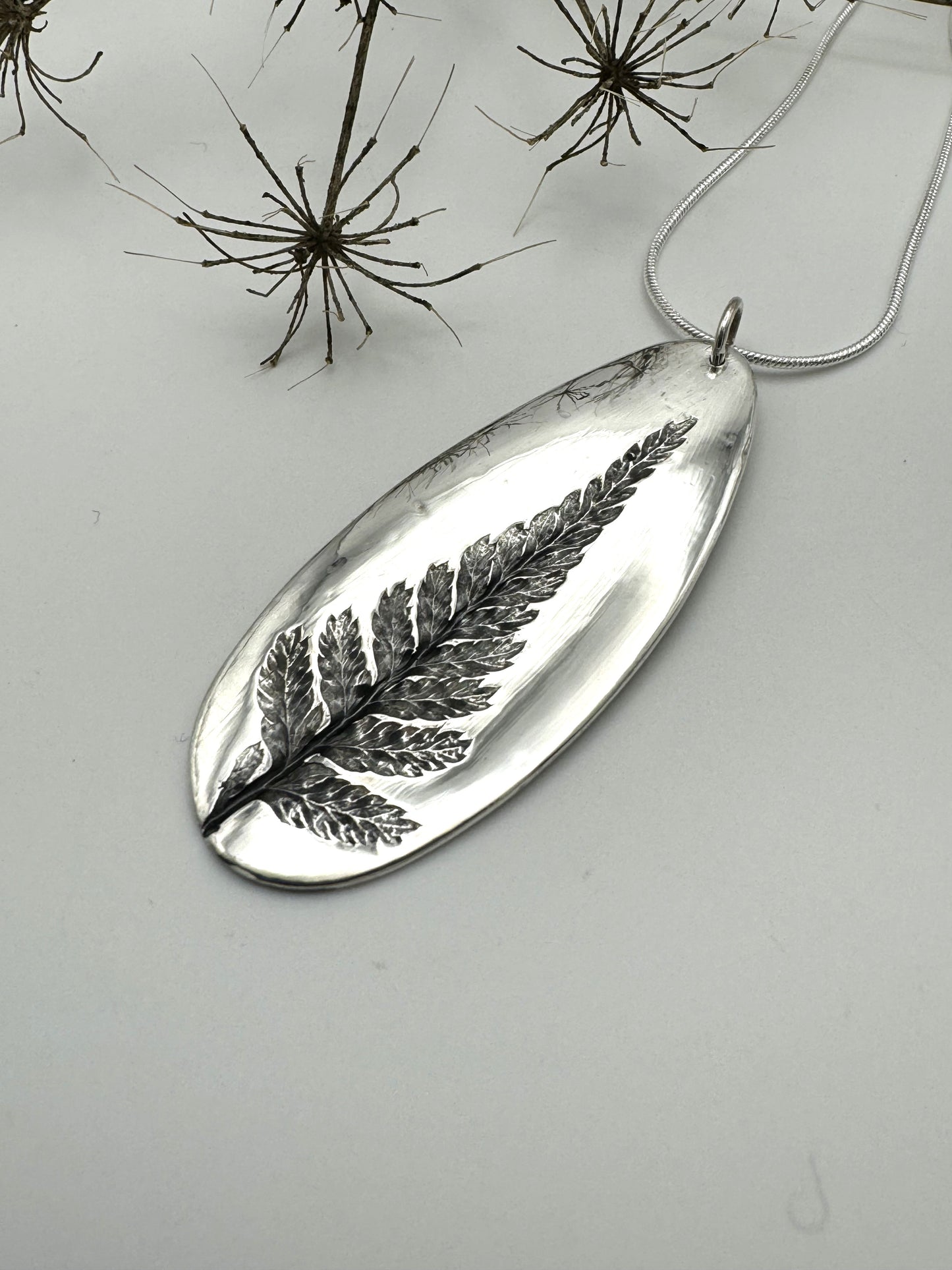 Fern imprint fine silver pendant
